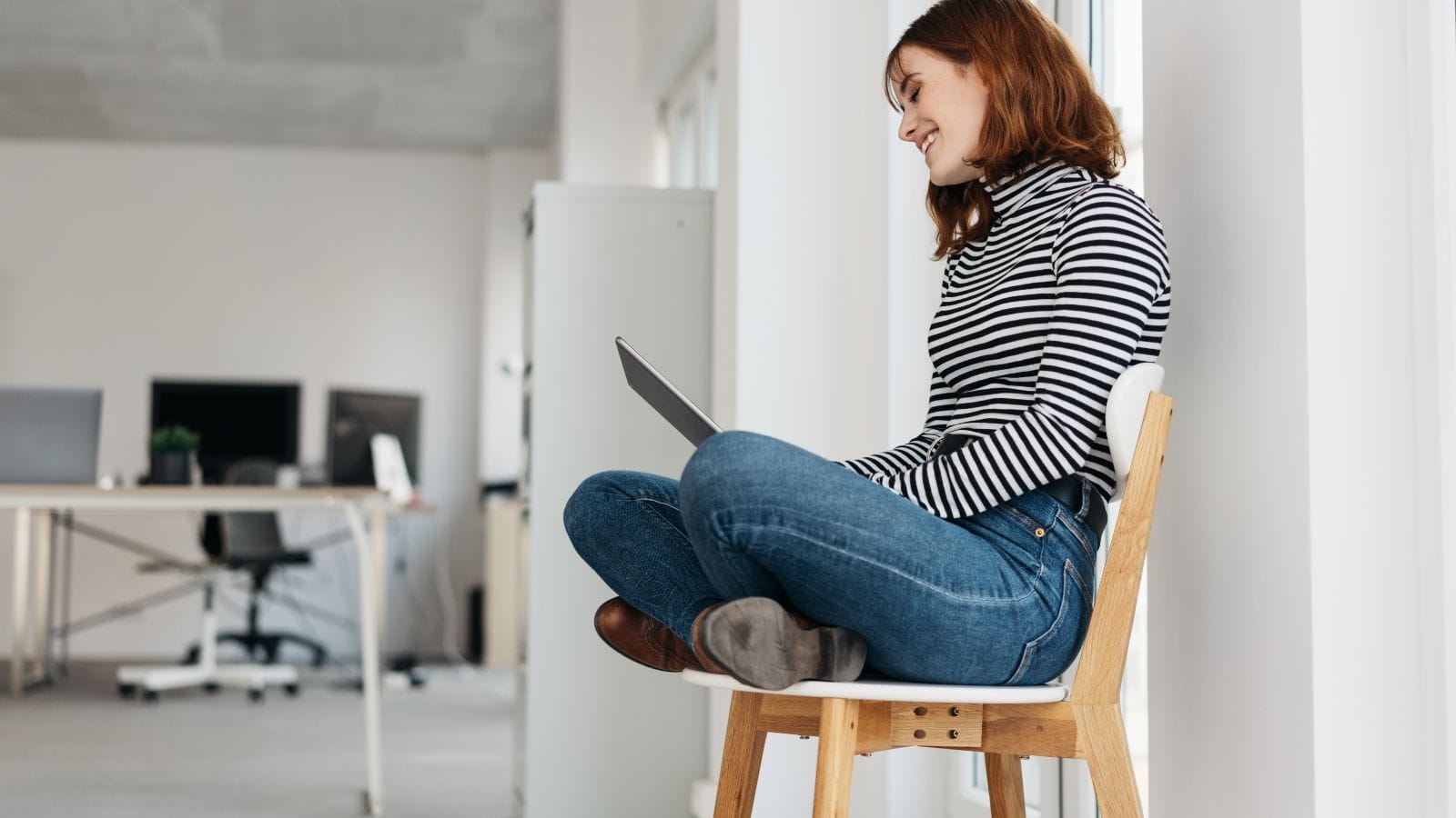 a woman sit cross legged