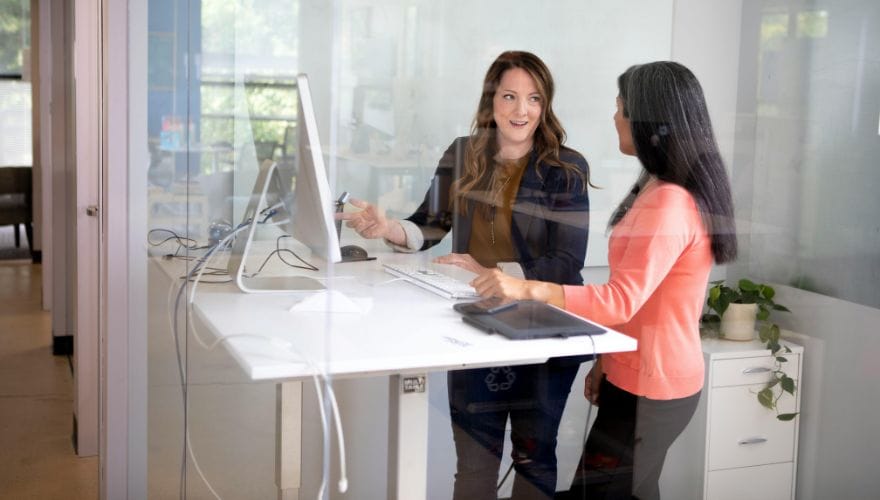 women using a standing desk
