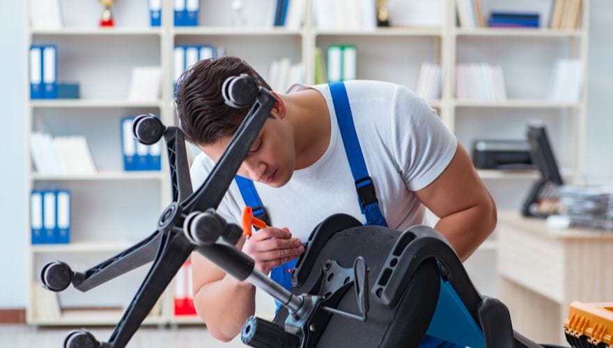 man fixing a chair