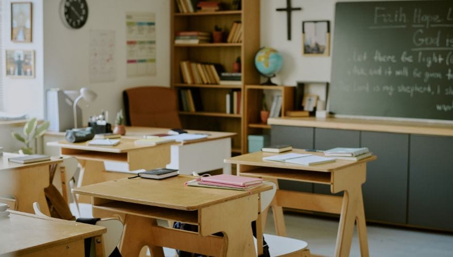 wooden student desks and chairs