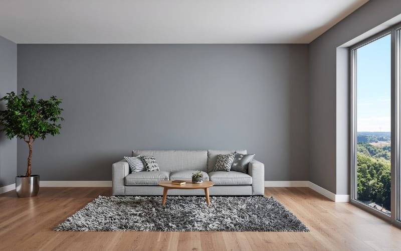 Gray sectional in a spacious apartment, showing sofa layout ideas for large open-plan rooms